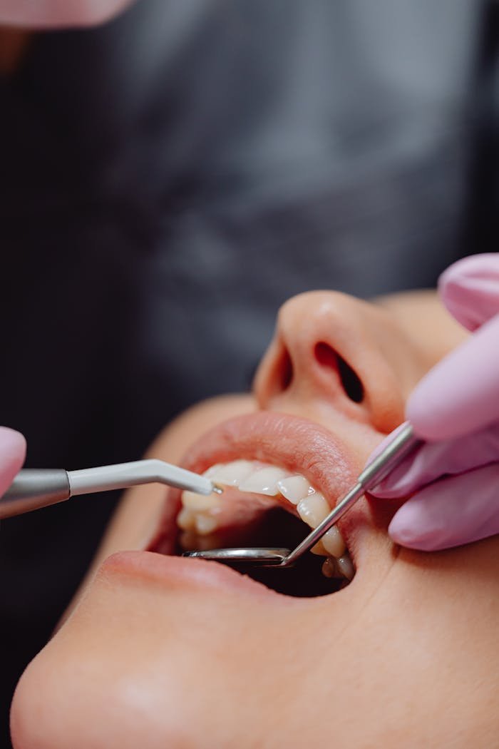 gallery-1 Close-up of dental procedure highlighting hygiene and patient care.